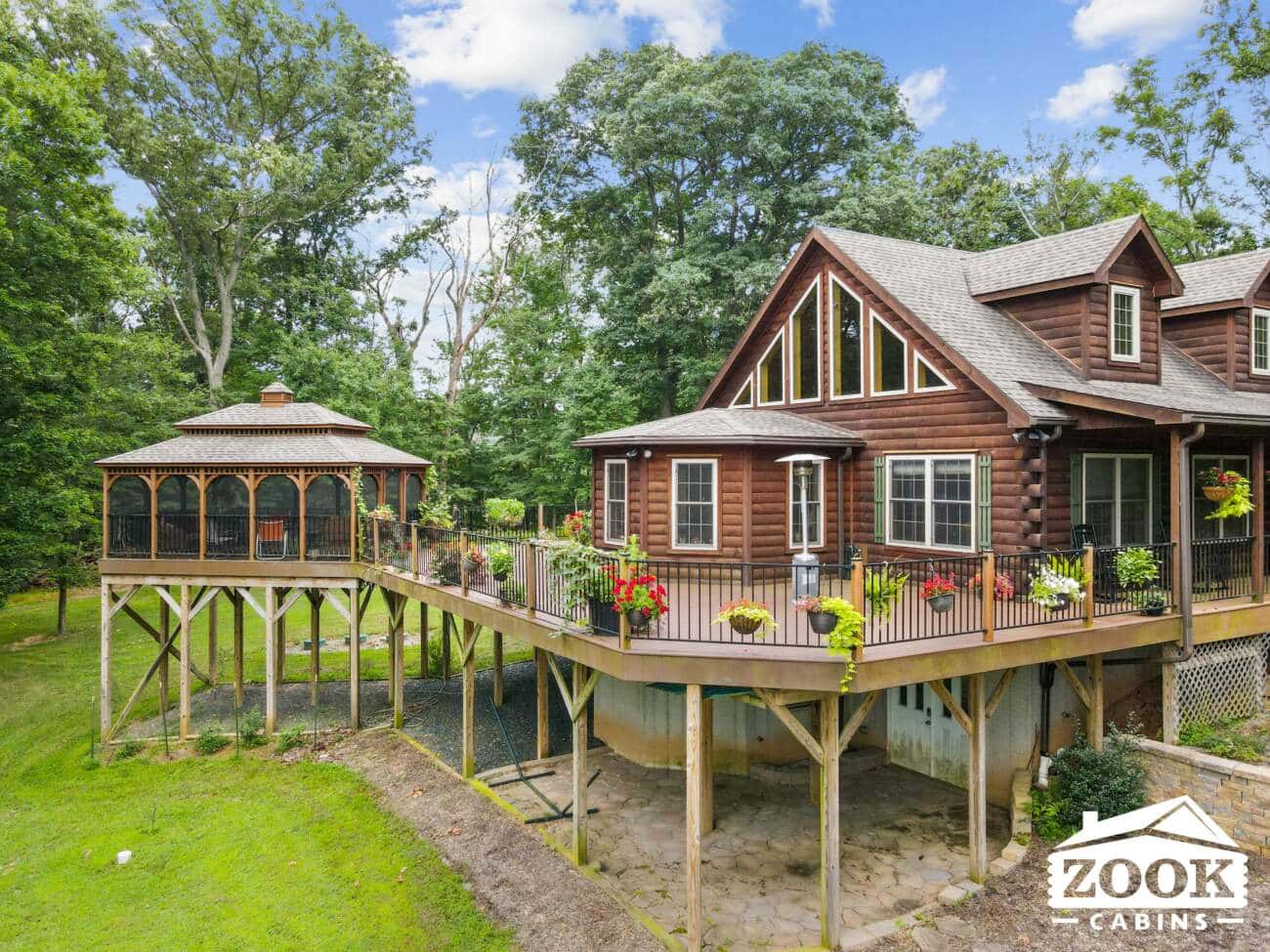 exterior of log cabin with huge deck and porch in Maryland