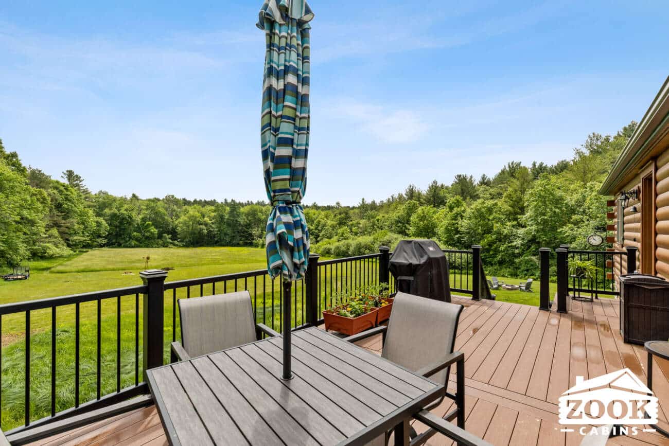 Back deck with view 26x44 Frontier Log Cabin in Monson MA