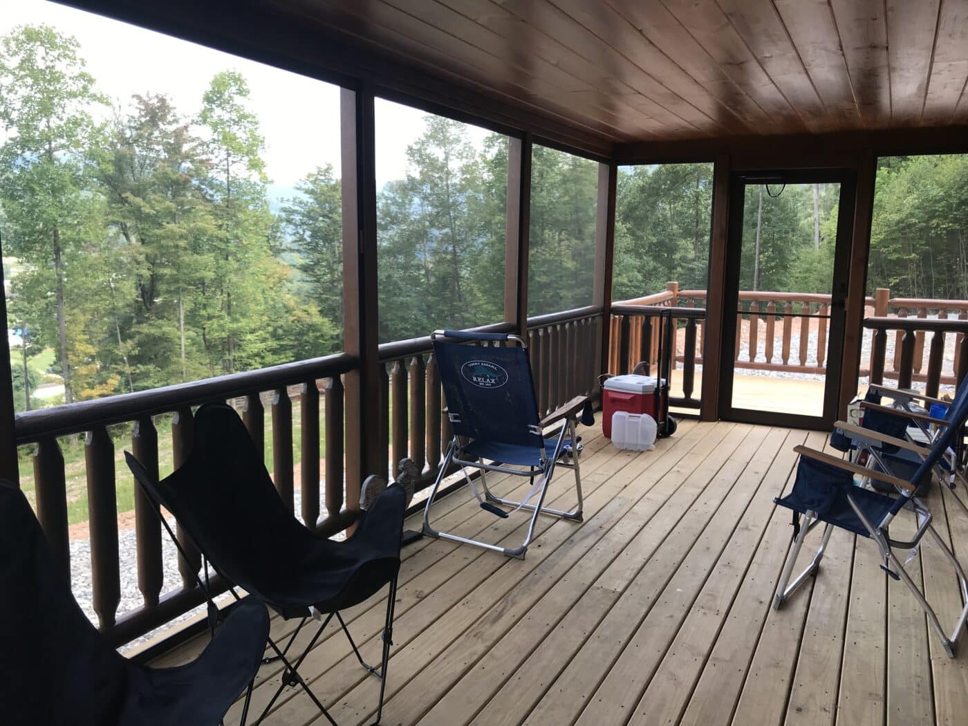 a prefab log cabins screened in deck overlooking the beautiful forest and mountains of parson west virginia