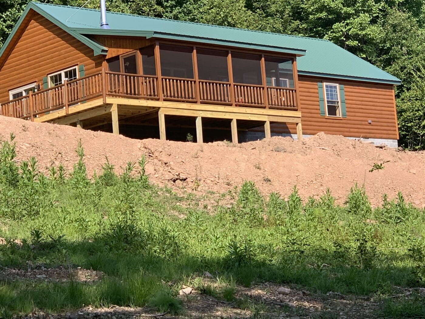 fully assembled prefab log cabin with gorgeous screened in deck on the mountain of parson west virginia