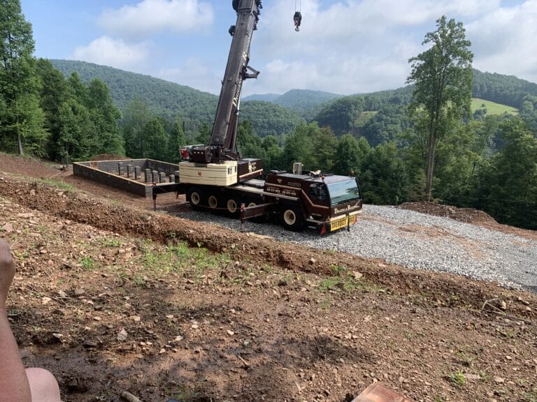 site prep complete with crane for the arrival of the prefab log cabin