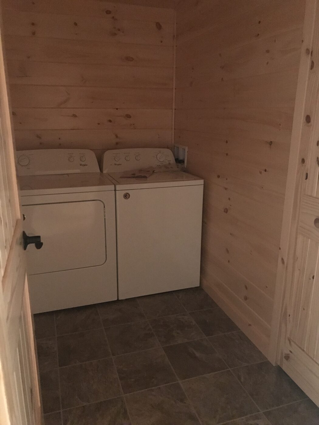 spacious laundry room in a new prefab log cabin