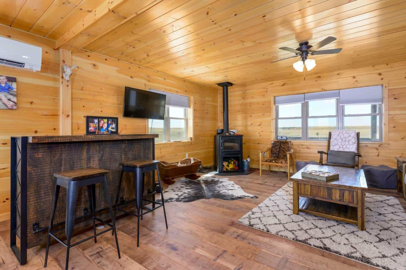 Livingroom with fireplace in Prefab Cabin in Russell KS