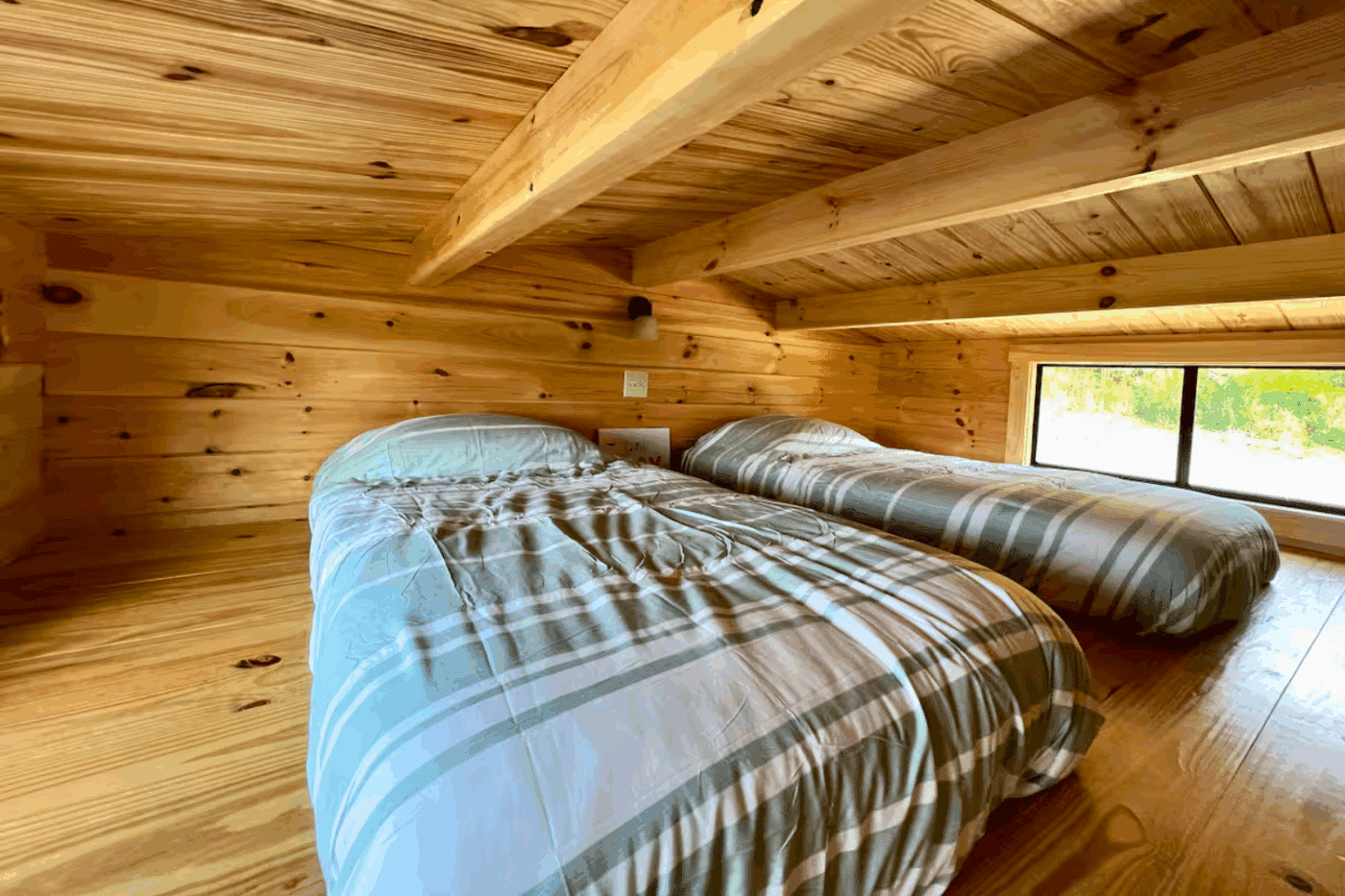 lofted sleeping area in Zook Cabins Pinecrest park model tiny home in Fallen timber pa