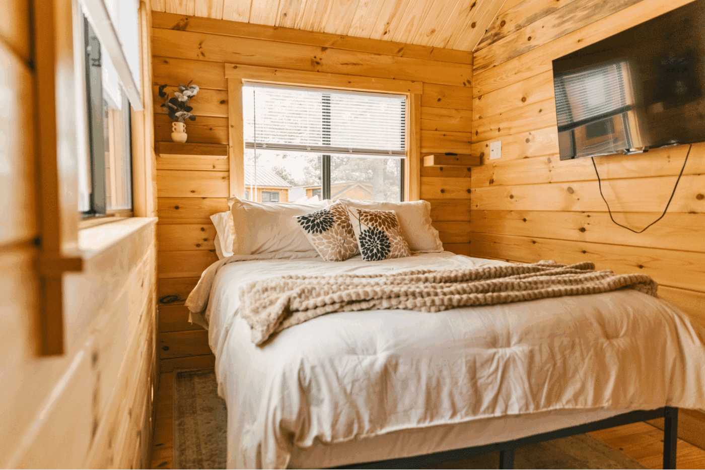 Main bedroom of pinecrest park model tiny home built and designed By Zook Cabins