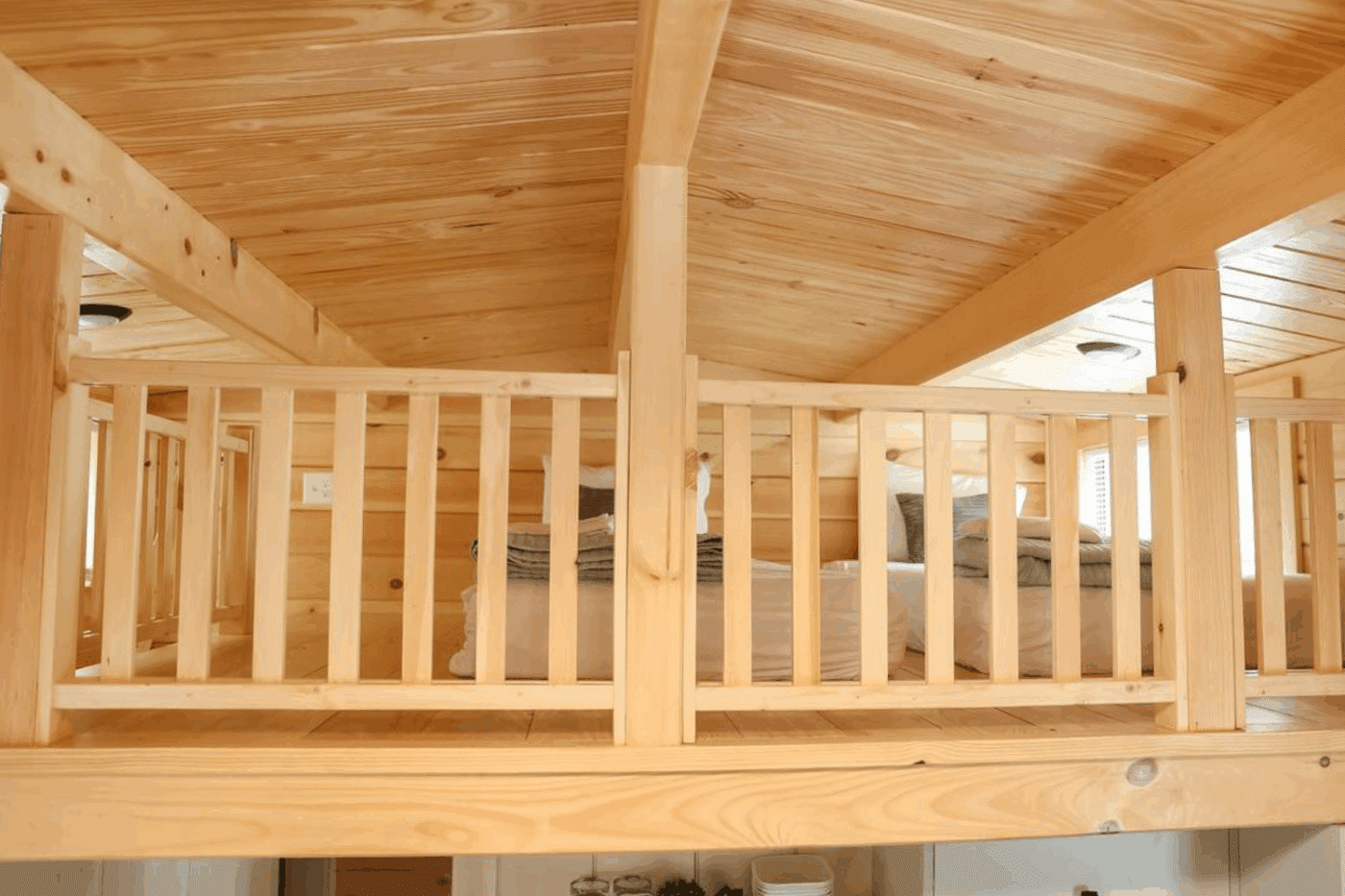 lofted sleeping area in glen mills pa park model tiny home Pinecrest built and designed by Zook Cabins