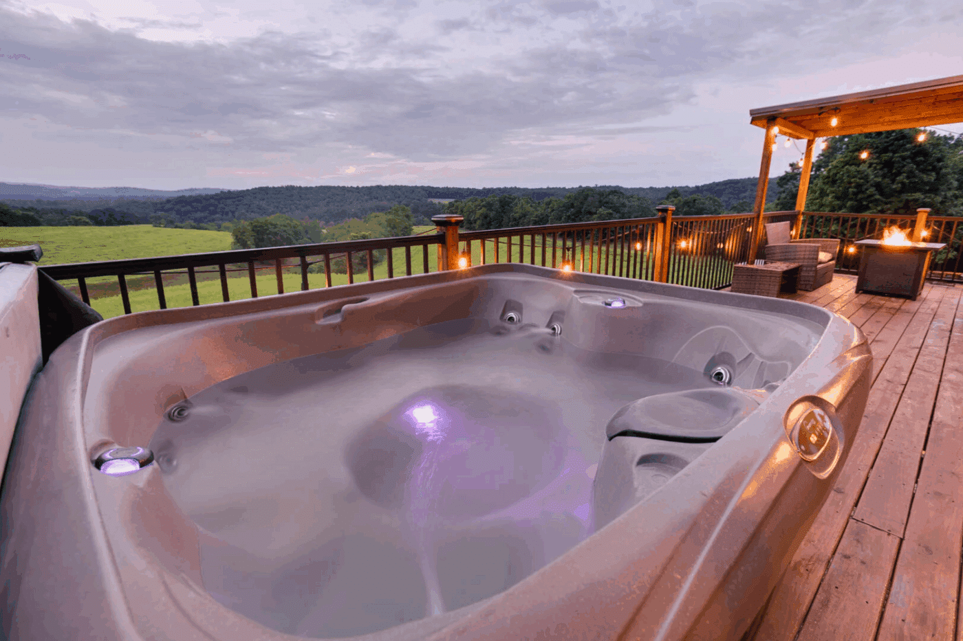 Hot Tub on front porch of Pinecrest park model tiny home in Warfordsburg Pa built and designed by Zook Cabins