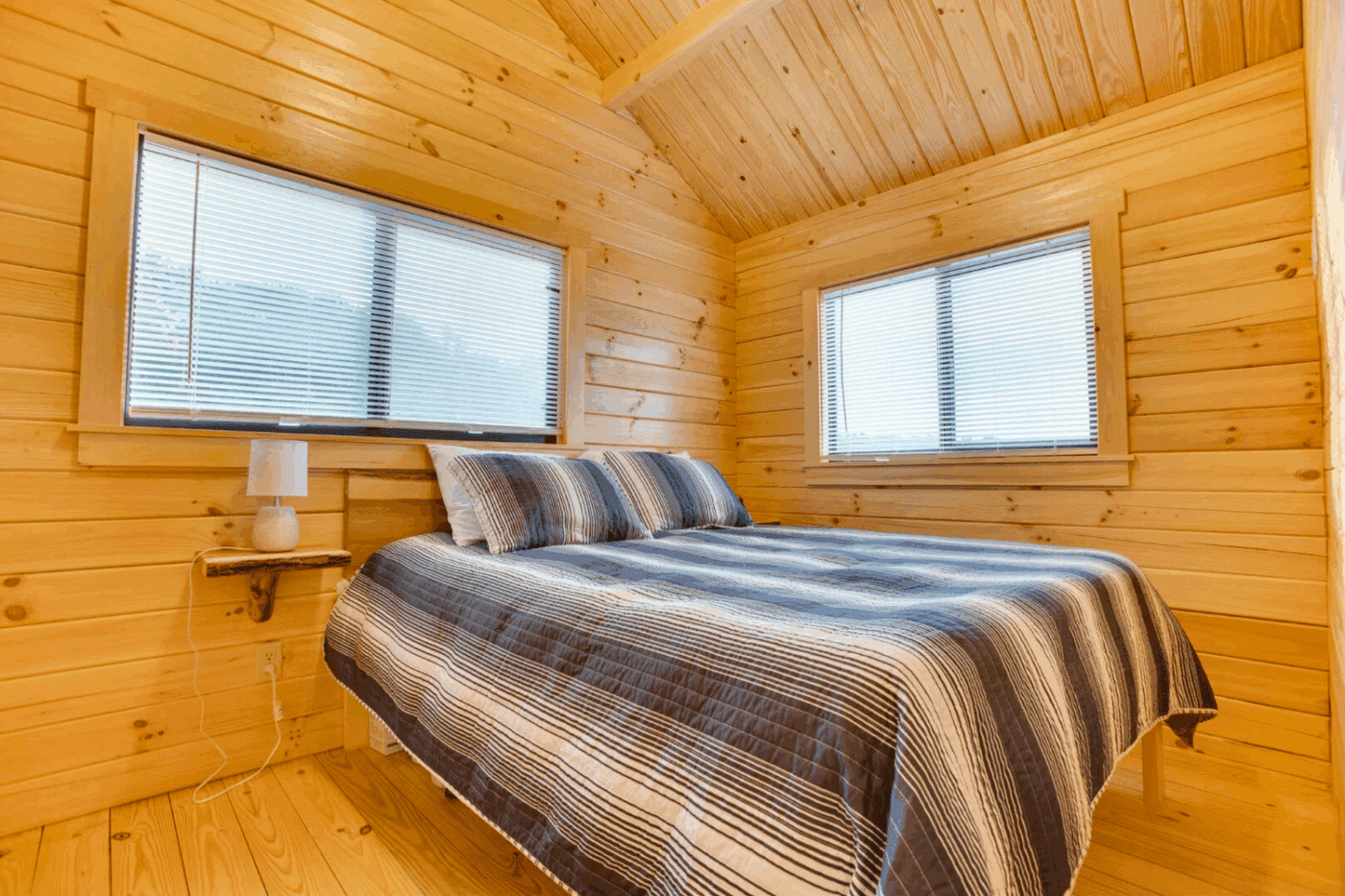 main bedroom in Pinecrest park model tiny home built and designed by Zook Cabins located in gap pa with tiny house in Warfordsburg Pa