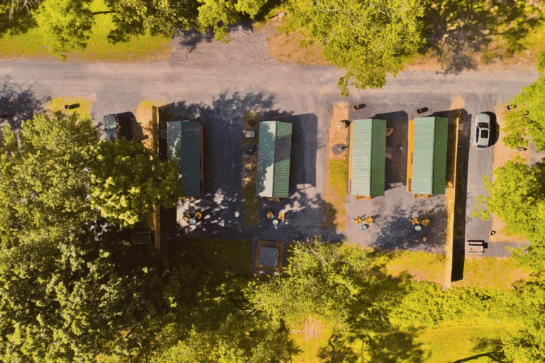 Log Studio park model tiny home in Pond Eddy New York at The Outpost Resort site 2