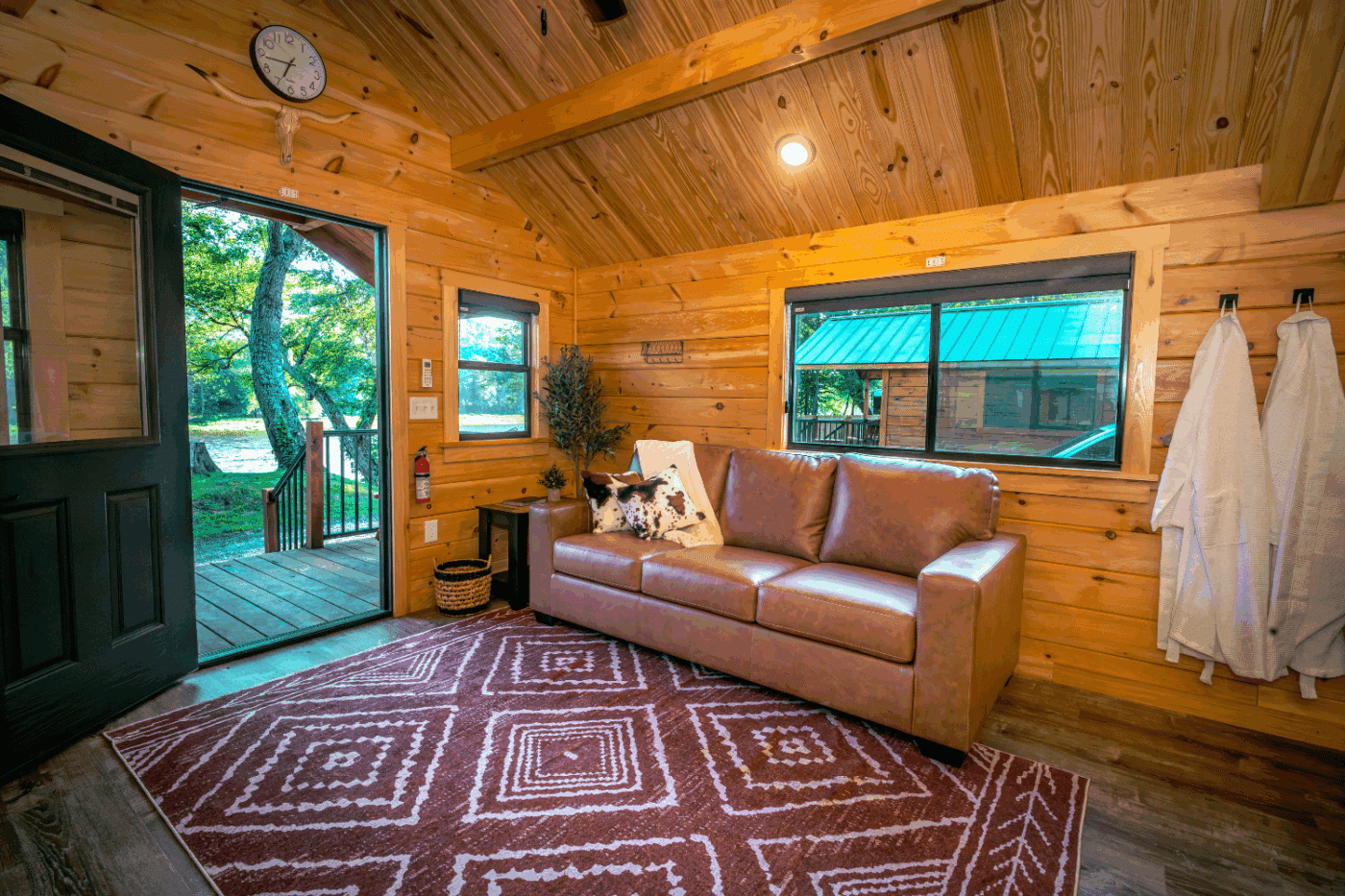 Log Studio park model tiny home at The outpost resort in Pond Eddy New York built and designed by Zook Cabins