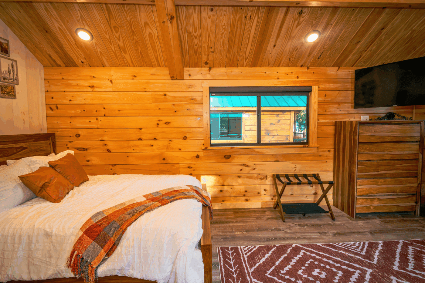 sleeping area of log studio park model tiny home built and designed by Zook Cabins cabin 1