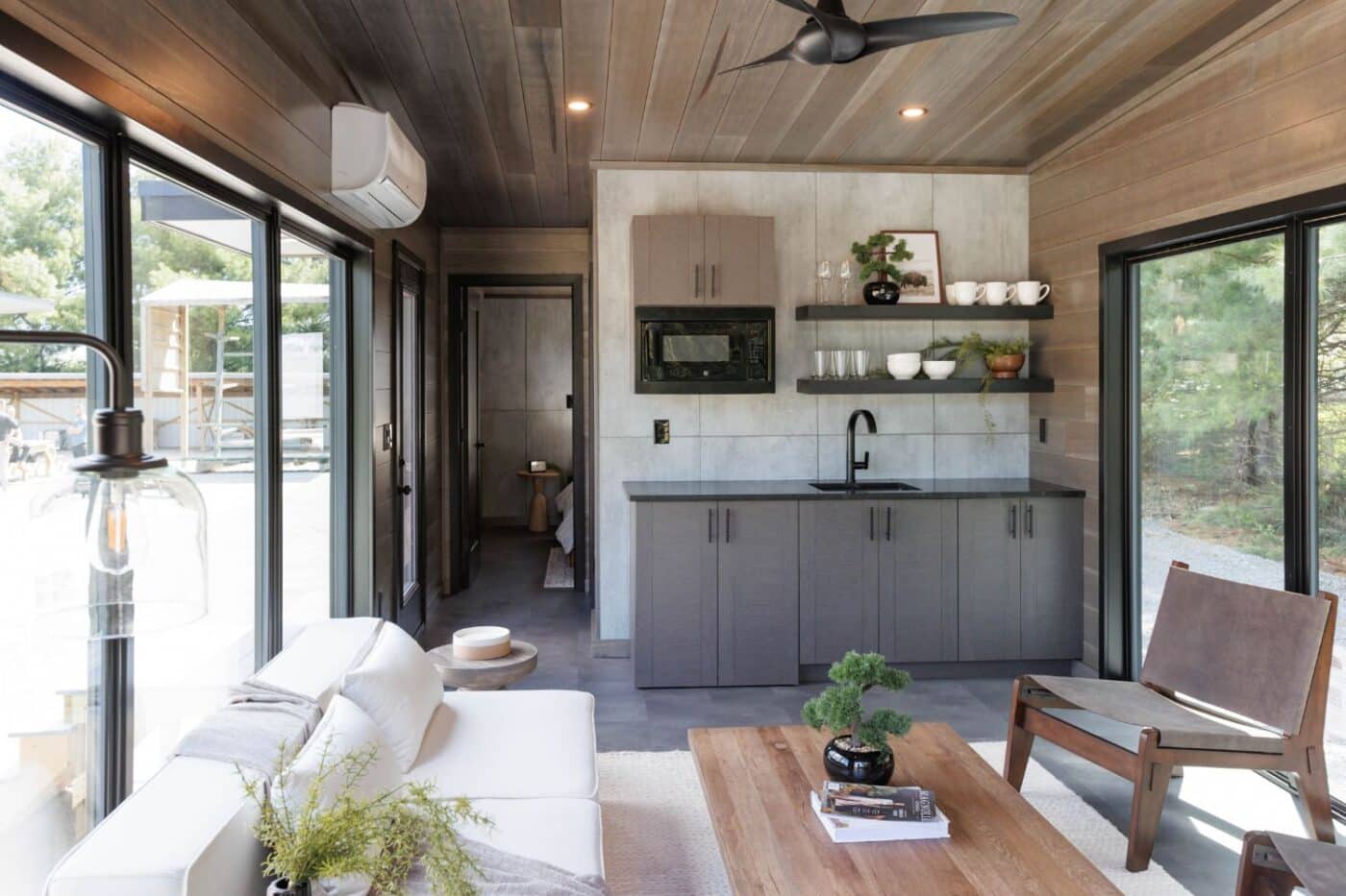 Inside of Rockwood tiny home with view of kitchen and hallway from living room