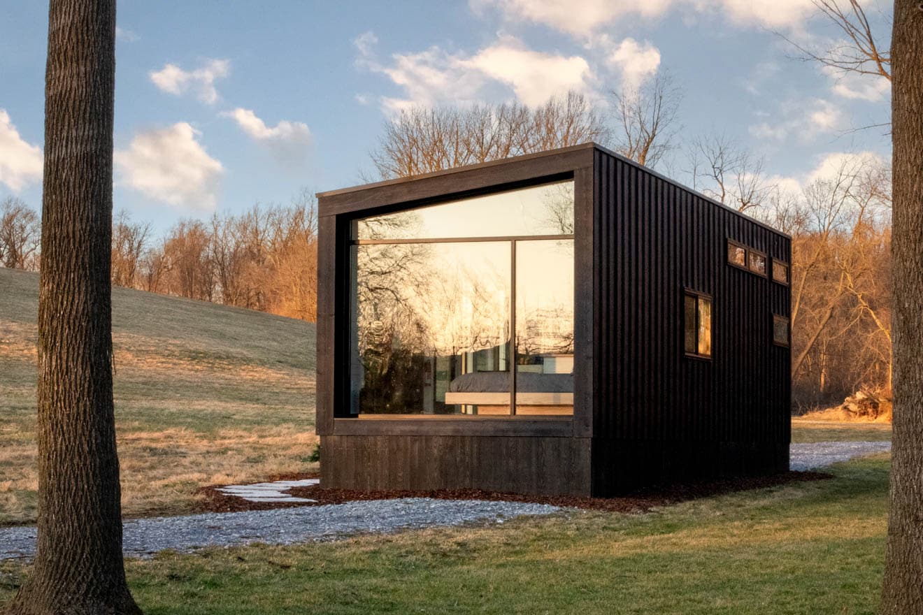 Modern tiny home outside during sunset