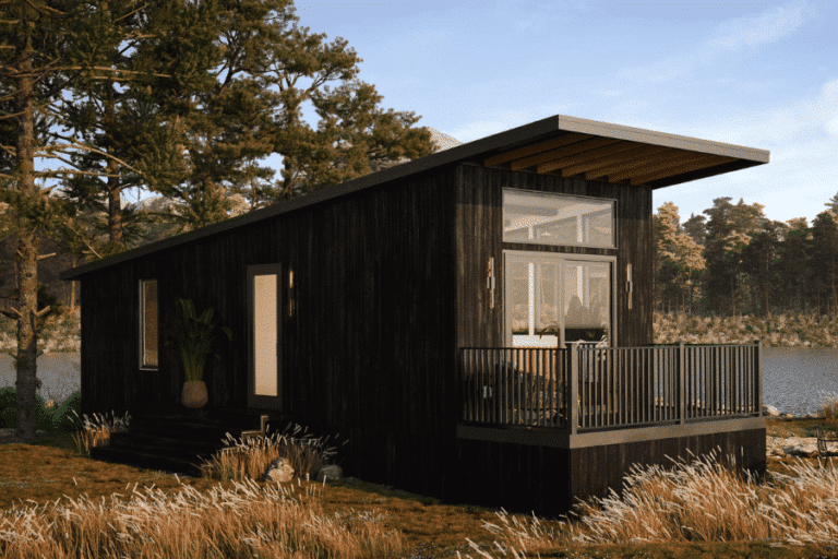 a black Park Model tiny home set by a lake in Louisiana