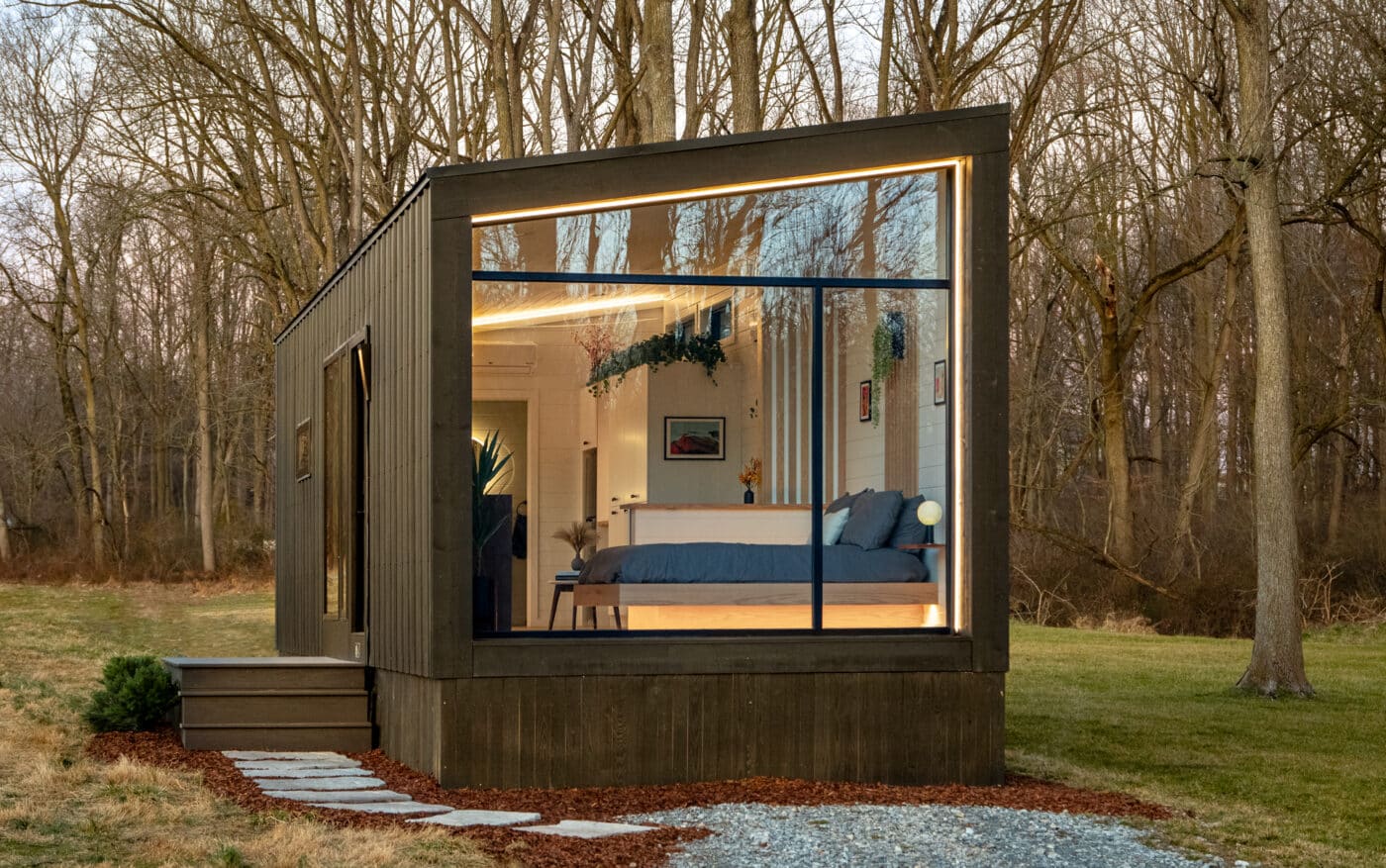 side view of luna park model home in PA with open window showing bed