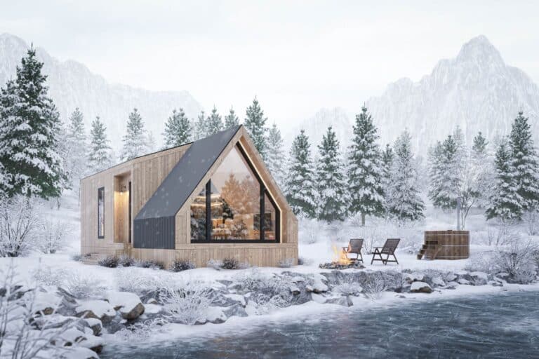 Tiny Home Regulations in Wyoming: White A-Frame Tiny Home in the Snow with Mountains in background