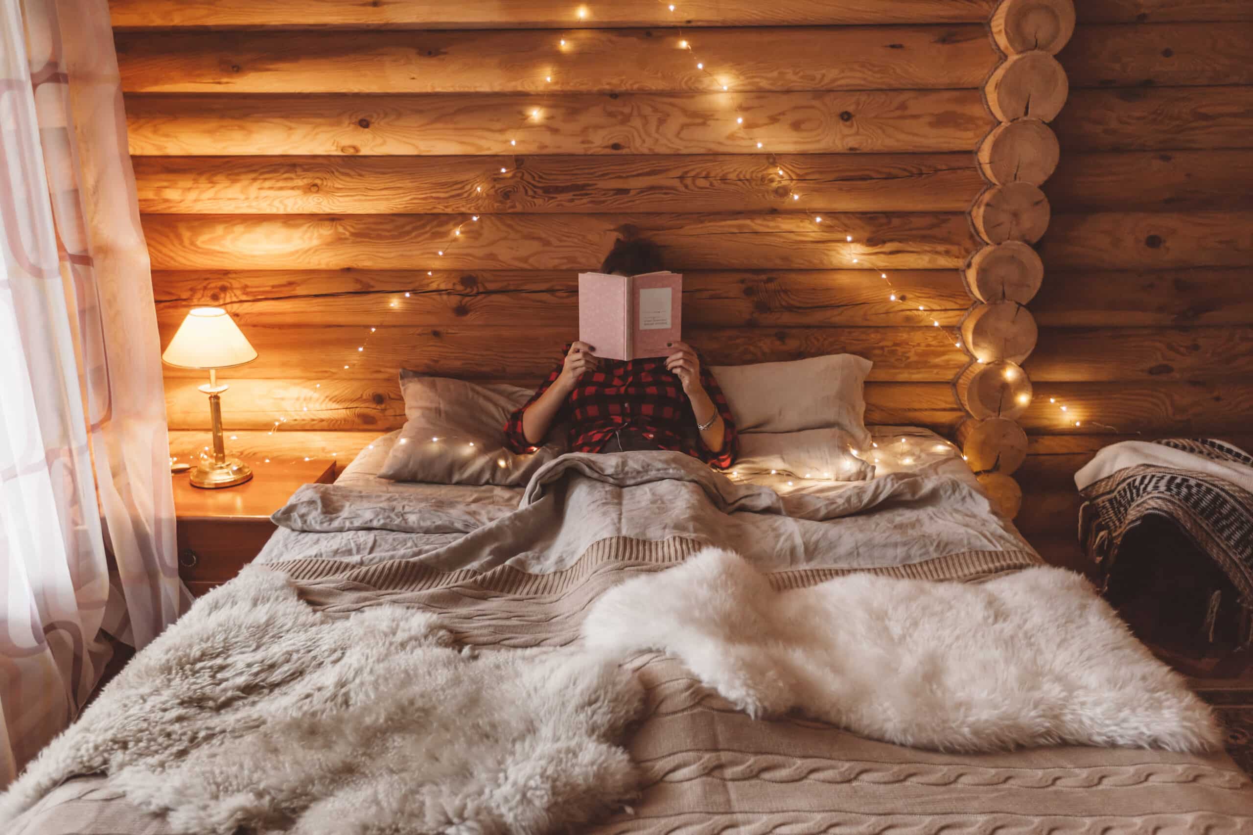 Beautiful bed in a cabin worth living in